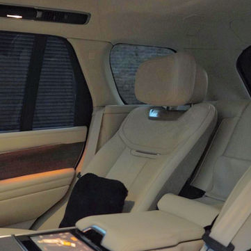Luxury car interior, cream leather seats, center console