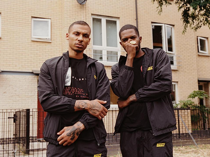 Fredo and Sincere Lizzy aka Dion Hamilton posing in black and yellow Lizzy clothing Flee suit