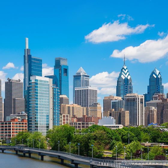 Philadelphia downtown skyline with blue sky and white cloud.jpg