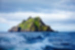 Cliffside view of Skellig Michael rising from the Atlantic Ocean as seen in the Star Wars sequel trilogy