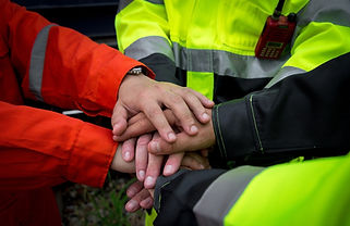 Essential workers hands together in collaboration