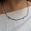 Thumbnail: Ketting met meerdere gekleurde edelstenen