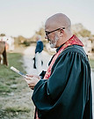 priest giving the blessing to the hounds, horses, riders and foxes