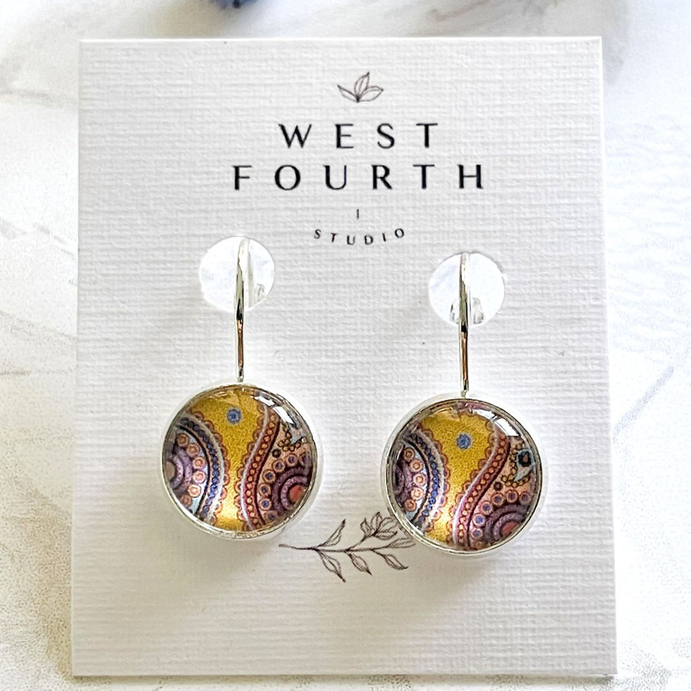 Thumbnail: Yellow paisley pattern earrings close up