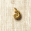 Thumbnail: gold large shell charm ready to add to a necklace