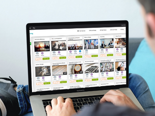 Man on laptop looking at VTRLearning courses.