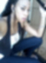 Airica Sada sitting on stairs