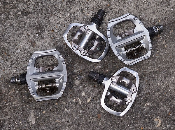 two different pairs of spd pedals for cycling