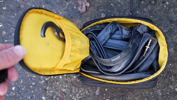 topeak rx trunk bag open with inner tubes inside with yellow lining