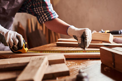 female-craftsmen-use-tape-measure-assemb