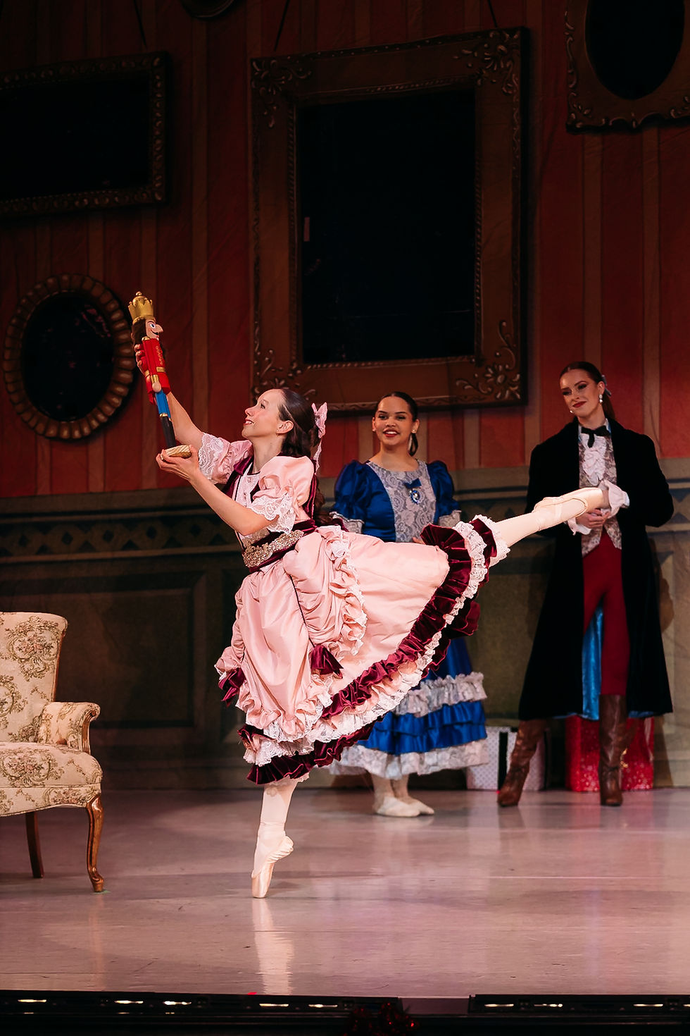 Ballet Wichita dancer performing as Clara on pointe holding the nutcracker during a performance at Century II in Wichita, Kansas - Hannah Jo Photography