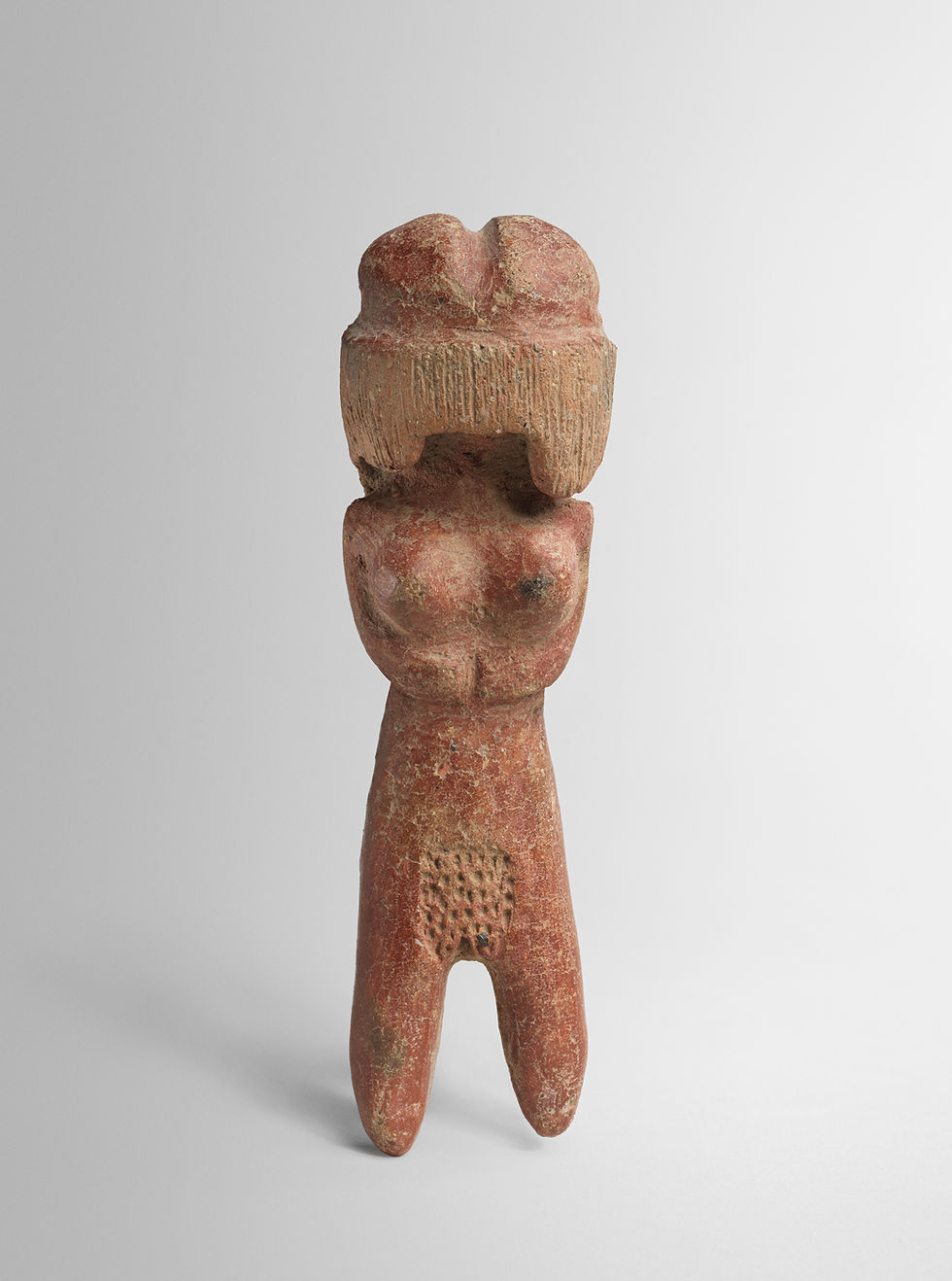 A Valdivia ceramic female figure from Ecuador, late third millennium BCE. The Met, 1980.83.15.