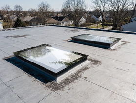 Infinity rooflight installed on a flat roof, offering a sleek, modern appearance.