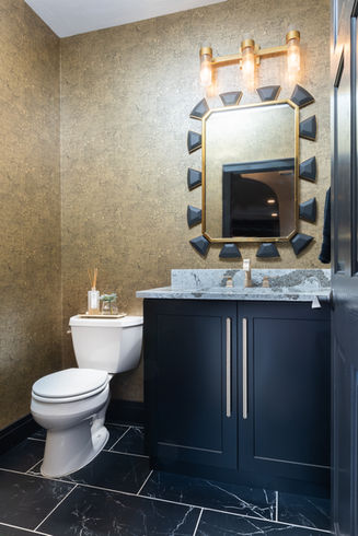 Powder bathroom with gold wallpaper, Cambria countertop, black marble tile and gold fixtures by Laura Lien Interior Design
