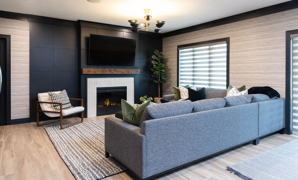 Family Room with black board and batten wall and grasscloth wallpaper by Laura Lien Interior Design