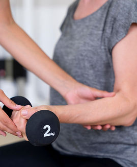 medical-assistant-helping-patient-with-physiotherapy-exercises.jpg