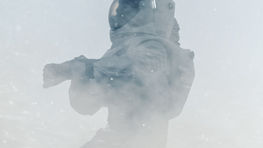 a man in a space suit has the number a328 on his helmet