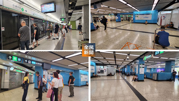 八號風球下,有市民趕上班等候列車