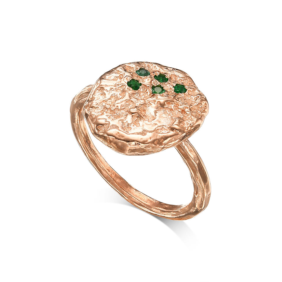 Rose gold ring with green stones