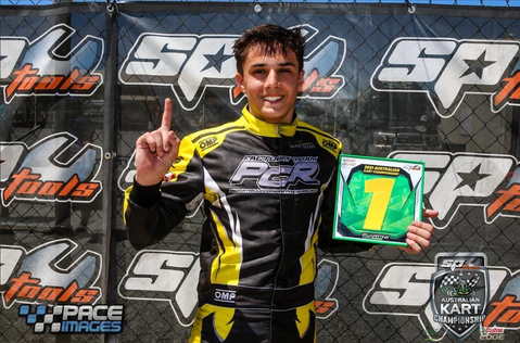 Alex Ninovic with the coveted green number 1 karting win plate