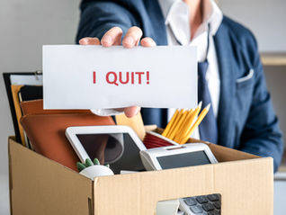 Images Of Local Government Professional Packing Up All His Personal Belongings And Files Into A Brown Cardboard Box