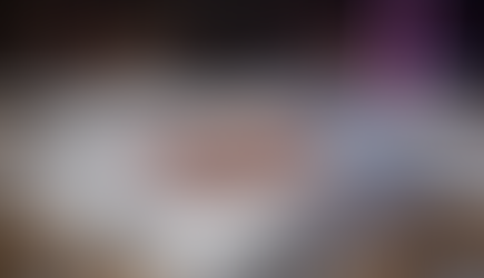 Bella and Riven's copper wedding bands on white silk