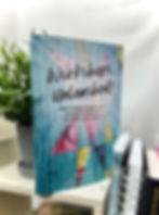 showing a book, Workshops Unleashed by Tori McElwain, on a shelf