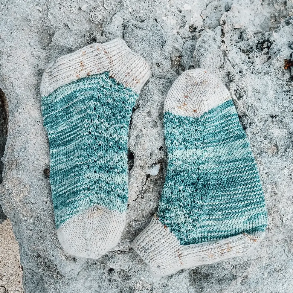 A pair of blue socks on a rock