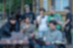 John Cho reviews a scene with writer Jung Seo-kyung (white shirt) and the Tempest crew