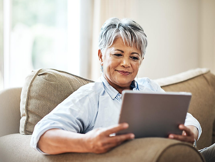 woman reading tablet at home
