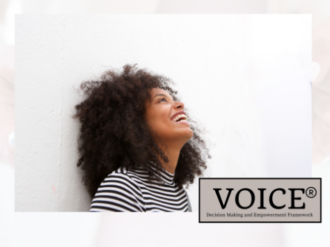 A woman laughing looking up.