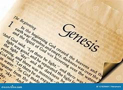 Close-up of a Bible page with the title "Genesis" in bold. Cream-colored paper, with visible text starting "In the beginning God created."