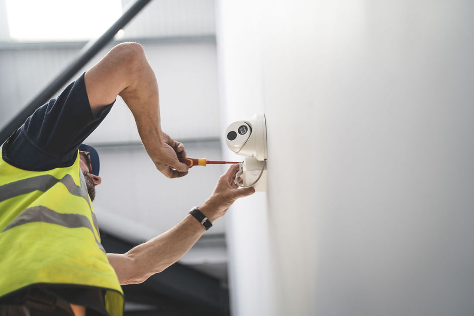 Man installing a CCTV system