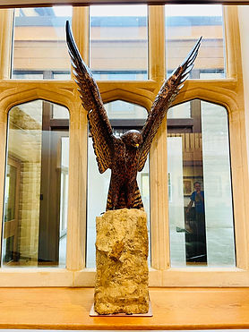 eagle sculpture perched on rock on display