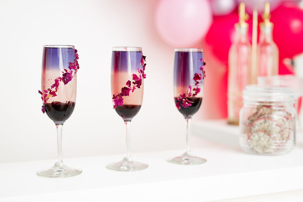 Layered cocktails with floral garnish for Ready Pour Packages.