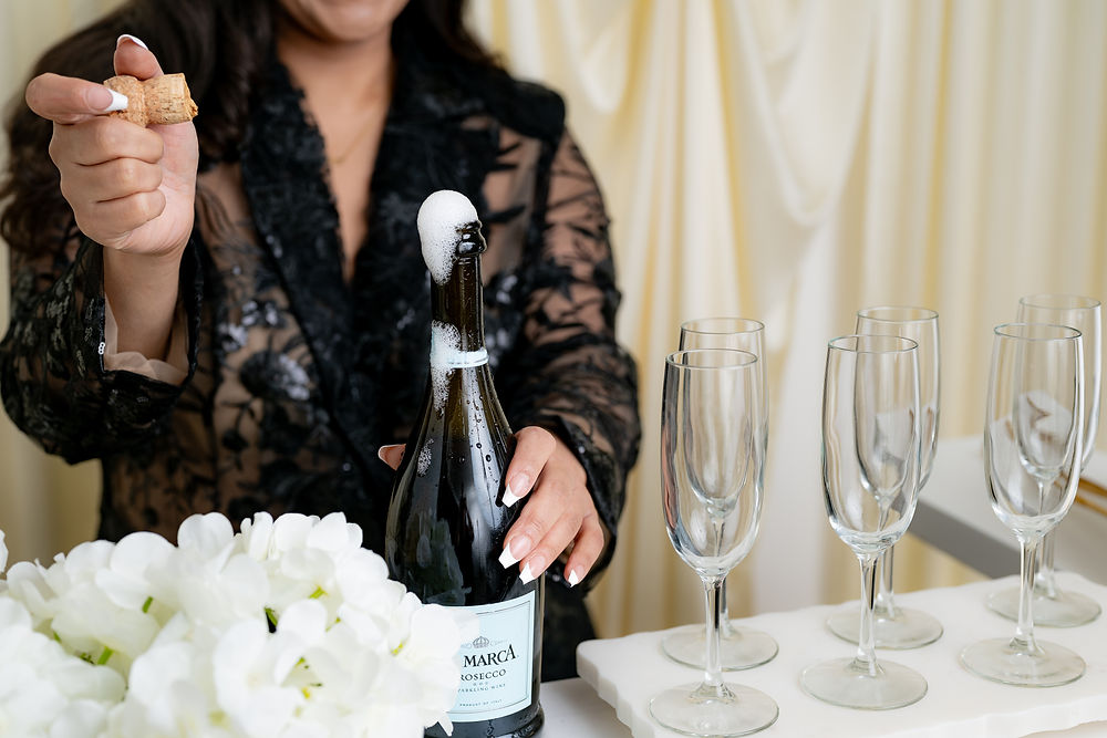 Woman opening sparkling wine, creating a festive experience