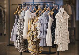Fashionable clothes in a boutique store