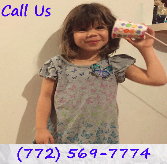 A child with a dixie cup and string phone