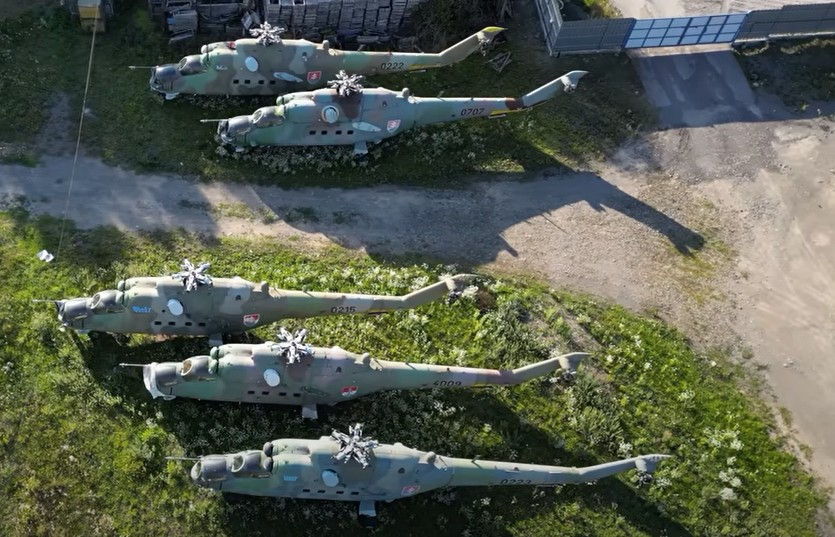 The five Mi-24 Hind helicopters in the storage lot (still from YouTube video)
