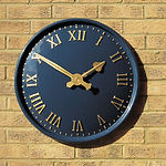 Exterior clock with Roman numerals and mains powered mechanism