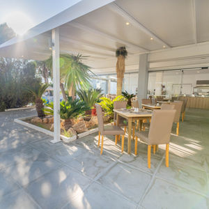 Outdoor dining area at Pefkos Breeze Family Resort and Spa in Rhodes