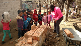moving bricks to cleanup.jpeg