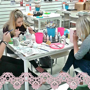 girls painting pottery at adults night