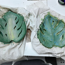 Hand painted tropical leaves made from clay.