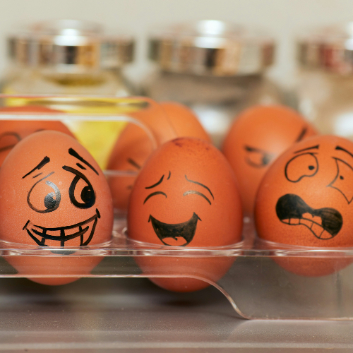 Emoji and facial expressions drawn onto eggs