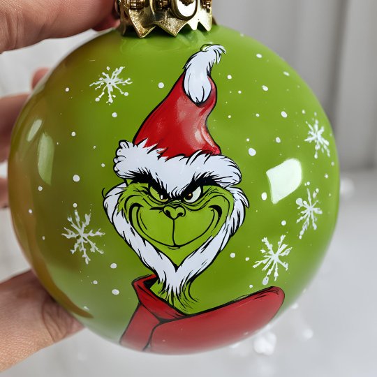 A Santa Grinch design on a bauble.