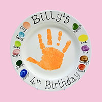 Childs special commemorative birthday plate with their handprint in the middle and guests fingerprints on the rim