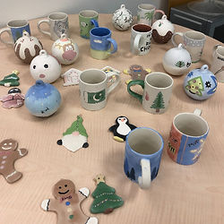 A selection of pottery painted in the workplace for a team building activity