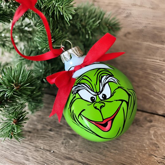 The Grinch painted on a Christmas Bauble