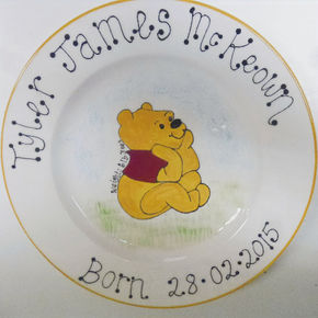 Personalised ceramic plate for new baby with Pooh Bear.